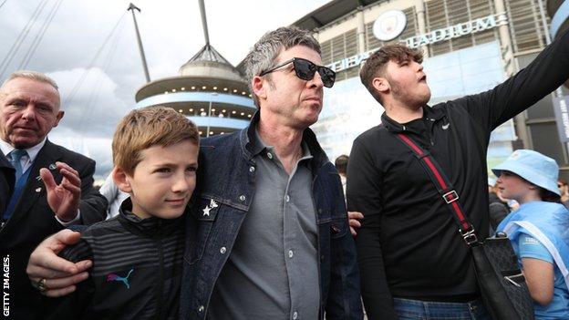 Noel Gallagher and Manchester City fans outside the Etihad.