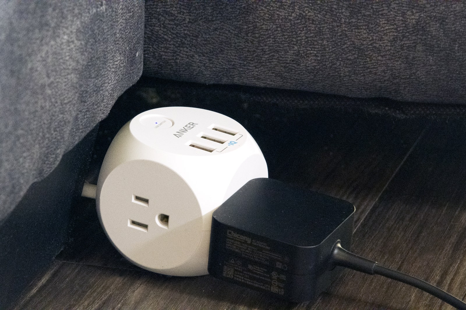 Anker Power Cube plugged in near couch
