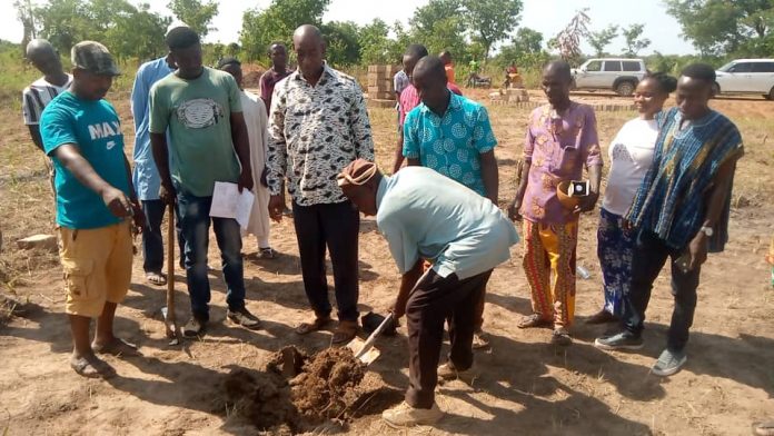 Kpandai DCE cutting sod for construction of CHPS compound