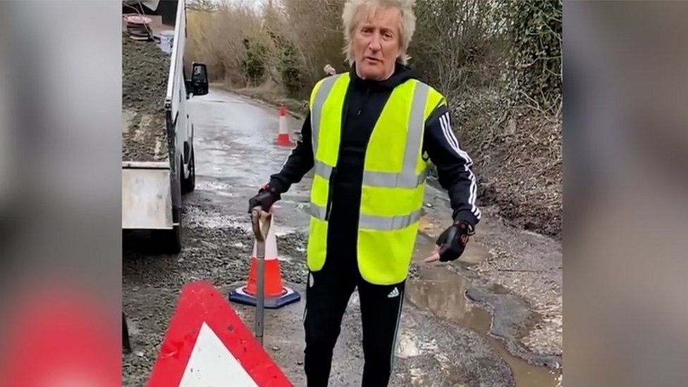 Sir Rod Stewart fixing potholes.