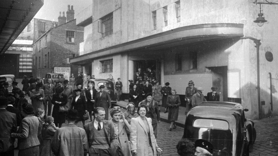 Crowds coming out of Oldham Coliseum theatre in 1946