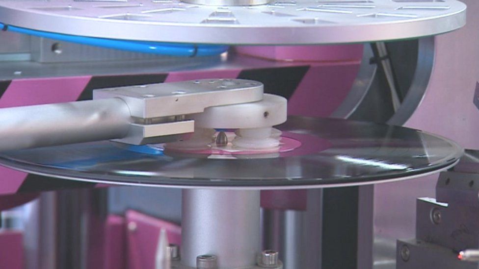 A vinyl record being produced