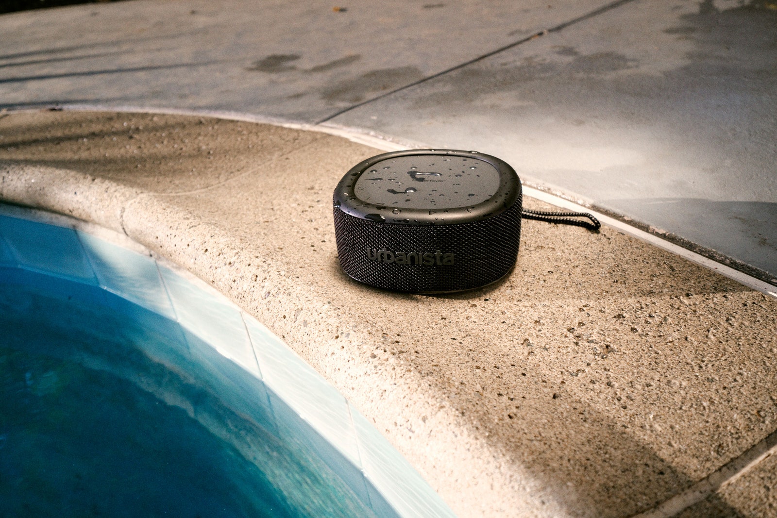 midnight black speaker near pool and wet