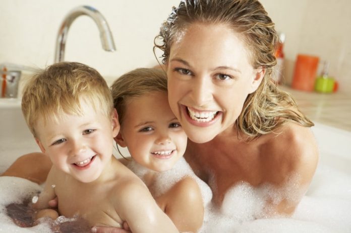 mom bathing with child