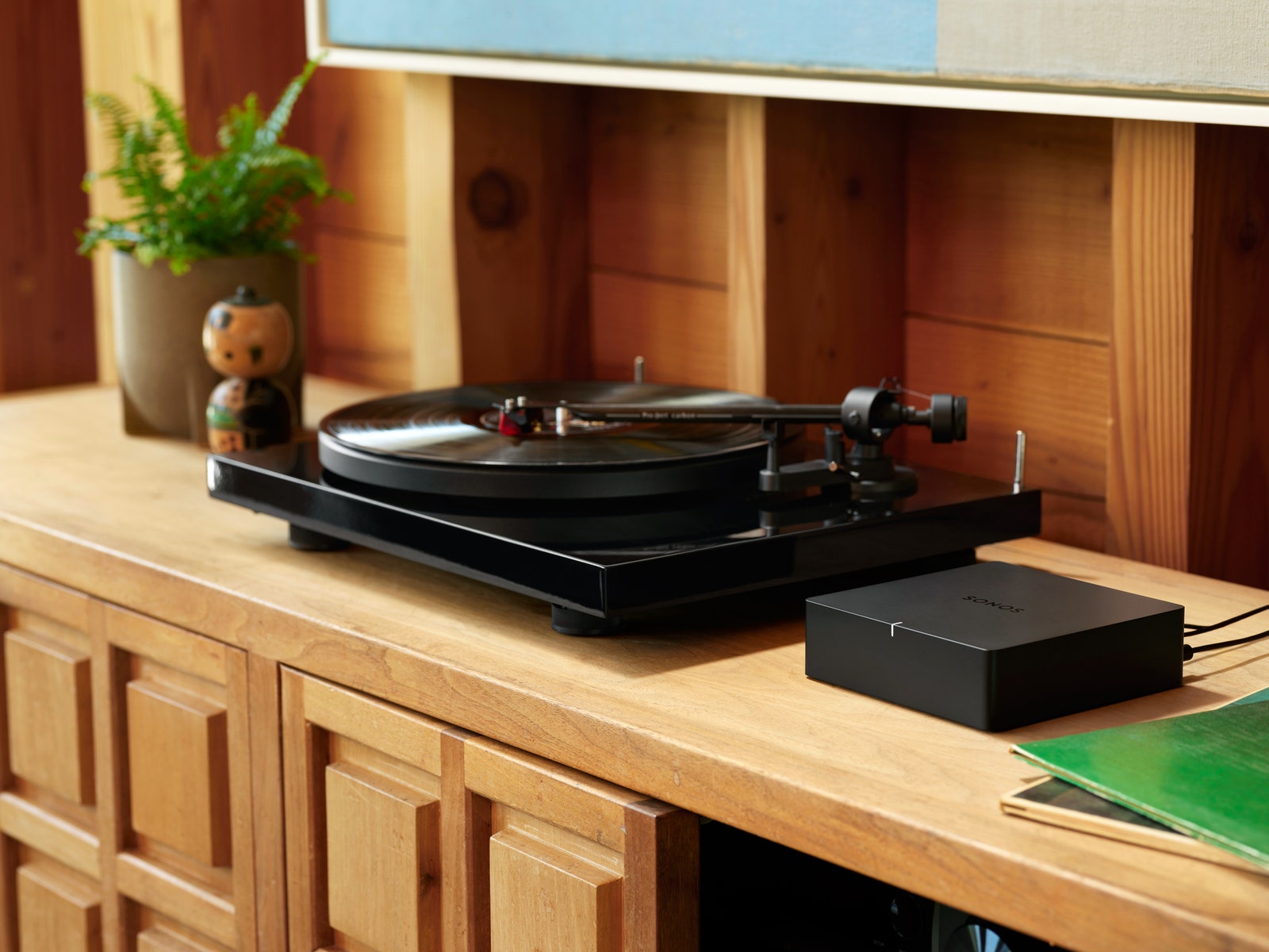 sonos port next to a record player