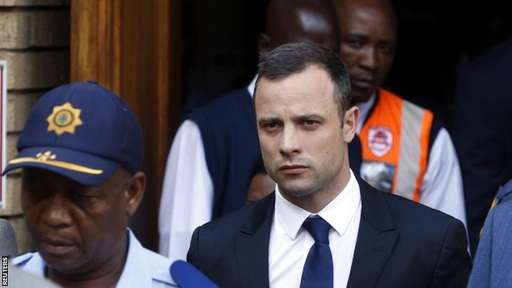 Oscar Pistorius Trial Day Four: The Paralympic Star Being Escorted Outside the Pretoria Court By Guards.