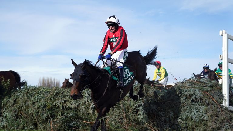 Via Dolorosa in action over the Grand National fences at Aintree in the Topham Handicap Chase