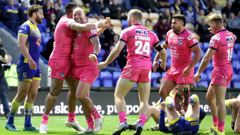 Leeds Rhinos' Bodene Thompson (third left) celebrates scoring his side's sixth try of the game with team-mates