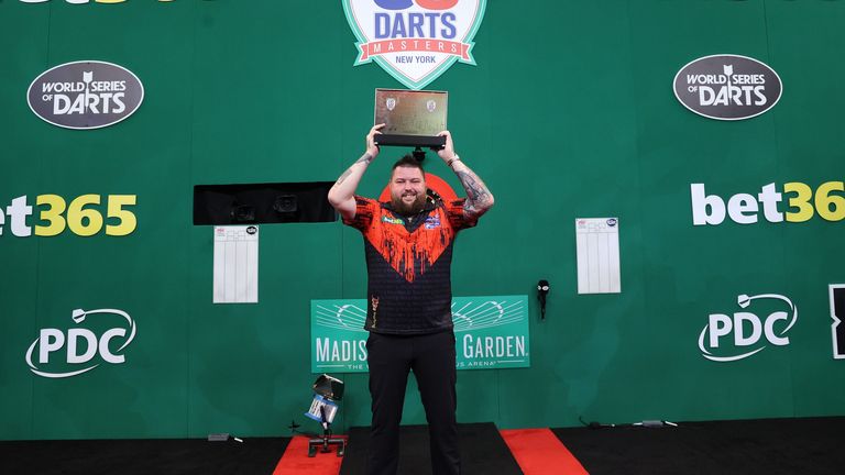 Smith lifts the trophy at the Hulu Theater at Madison Square Garden