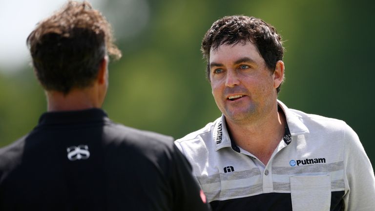 Keegan Bradley (right) holds a one-shot lead over Adam Scott (left) at the BMW Championship 