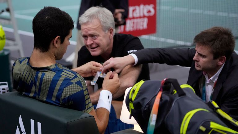Spain&#39;s Carlos Alcaraz is treated during his quarterfinal match of the Paris Masters tennis tournament against Holger Rune from Denmark, at the Accor Arena, Friday, Nov. 4, 2022 in Paris. (AP Photo/Thibault Camus)