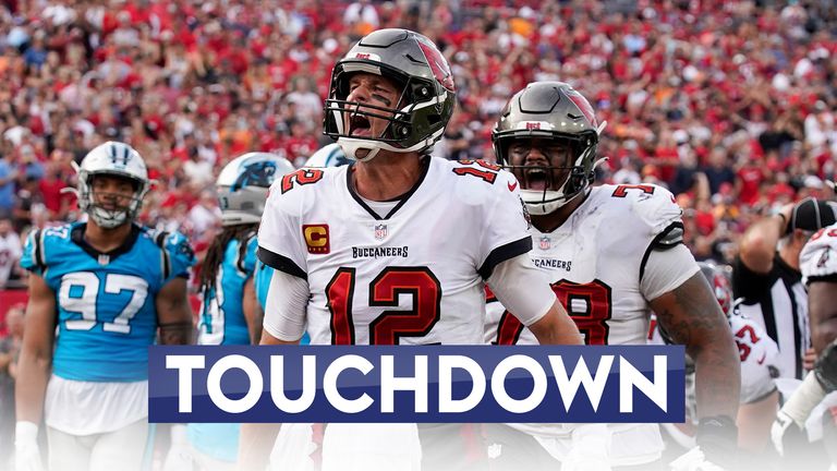 Tom Brady scored four touchdowns, throwing three to Mike Evans, as the Tampa Bay Buccaneers confirmed their playoff spot by beating the Carolina Panthers in Week 17.