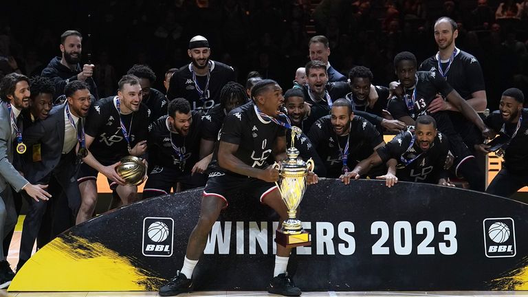 Ovie Soko lifts the trophy after London Lions beat Leicester Riders to win the BBL Cup Final.