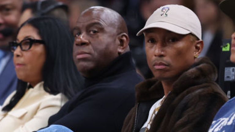 Pharrell Williams and Magic Johnson were sat together at the event 
