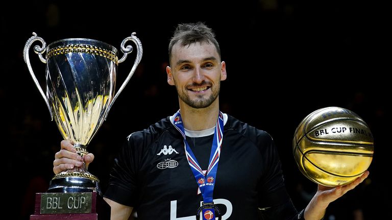 Sam Dekker celebrates with the trophy and his MVP award