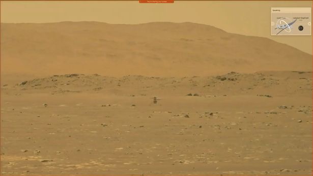 NASA's Mars helicopter Ingenuity is seen during its first flight on the planet in this still image taken from a video on April 19, 2021
