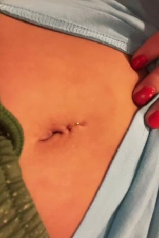 Faith said it took her eight years to realise her belly button wasn't actually pierced