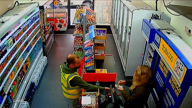 The unidentified man, who was wearing a high-visibility jacket emblazoned with the words 'Social distancing' and 'keep 3 metres apart', successfully conned shopkeeper Nazanin Safizadeh, 34. Above: Ms Safizadeh handing the man the initially correct change