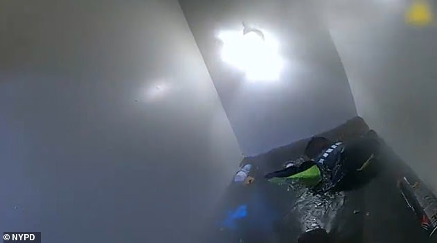 After diving underwater in the flooded stairway in an attempt to gain access through the locked door of the basement apartment the NYPD called the FDNY for backup