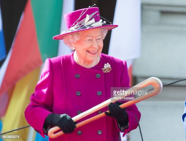 LONDON, ENGLAND - MARCH 13: Queen Elizabeth II holds the Commonwealth baton during the launch of The Queen's Baton Relay for the XXI Commonwealth Games being held on the Gold Coast in 2018 at Buckingham Palace on March 13, 2017 in London, England. (Photo by Samir Hussein/Samir Hussein/WireImage) LONDON, ENGLAND - MARCH 13: Queen Elizabeth II holds the Commonwealth baton during the launch of The Queen's Baton Relay for the XXI Commonwealth Games being held on the Gold Coast in 2018 at Buckingham Palace on March 13, 2017 in London, England. (Photo by Samir Hussein/Samir Hussein/WireImage)