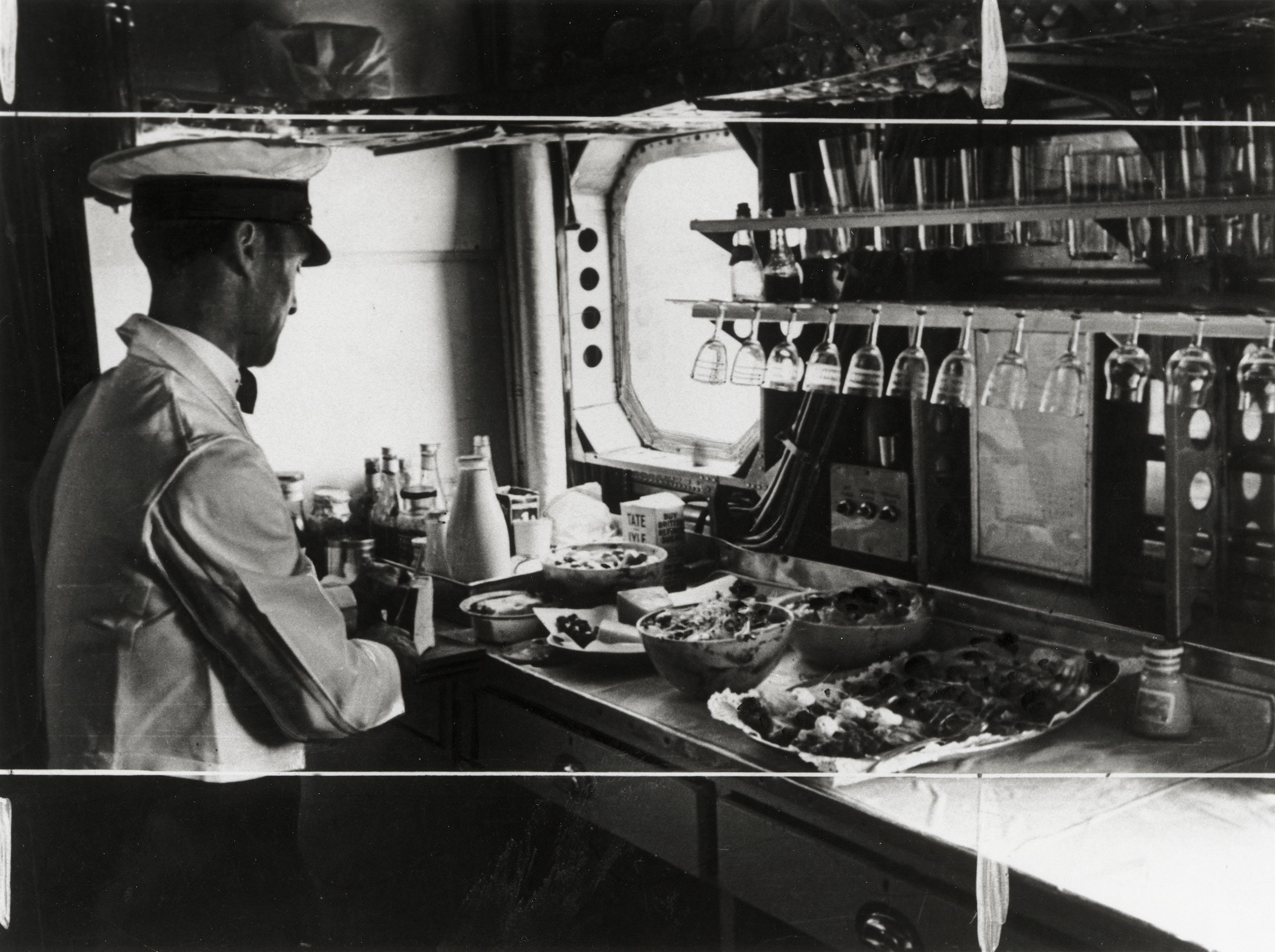 Preparing lunch on the Imperial Airways aeroplane 'Scylla', in November 1936