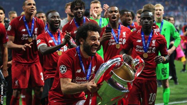 Mohamed Salah lifts the Champions League trophy with Liverpool in 2019