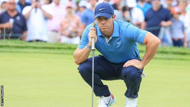 Rory McIlroy sizes up a putt