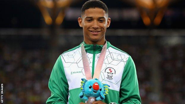 Leon Reid on the podium at the 2018 Commonwealth Games after winning a 200m bronze medal for Northern Ireland