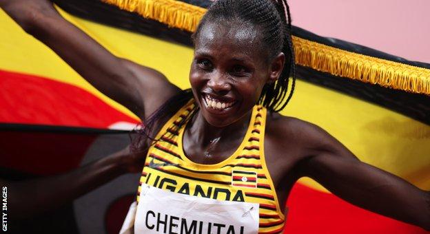 Peruth Chemutai celebrates winning gold at the Tokyo Olympics
