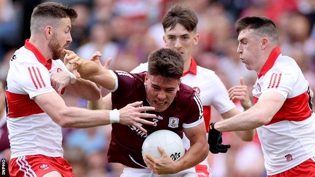 Sean Kelly holds on to possession in Galway's All-Ireland semi-final win over Derry despite the efforts of Niall Loughlin, Paul Cassidy and Gareth McKinless