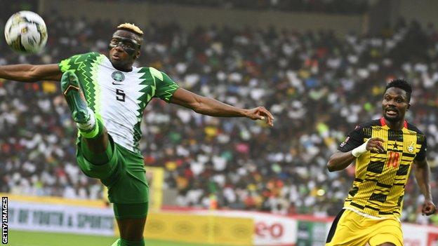 Victor Osimhen (left) in action for Nigeria against Ghana