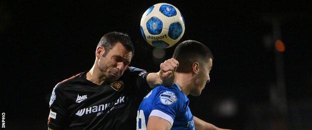 Jim Ervin of Carrick Rangers and Dungannon's Darragh McBrien
