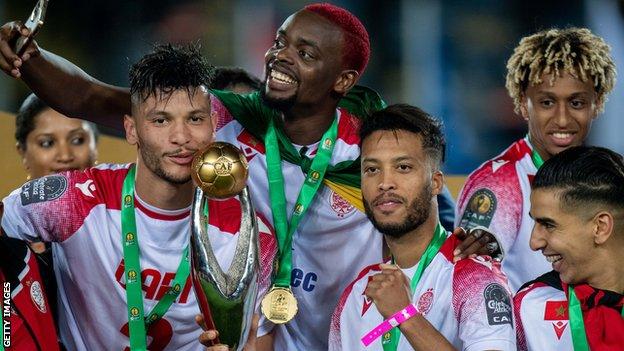 Wydad Casablanca players celebrate with the African Champions League trophy