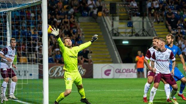 Linfield conceded two late goals after a battling performance in Riga