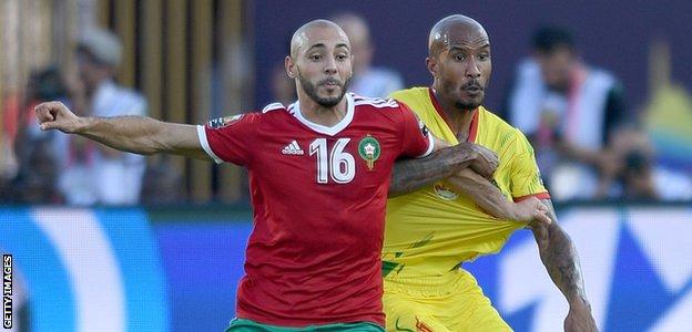 Nordin Amrabat and Emmanuel Imorou in action at the 2019 Africa Cup of Nations