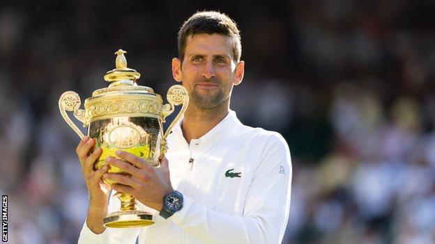 Novak Djokovic with the Wimbledon trophy