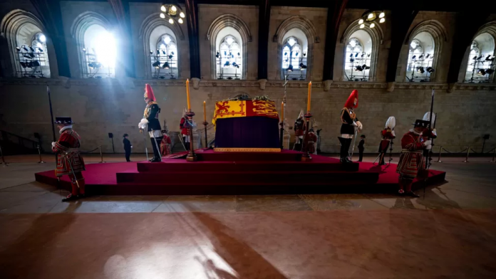 Thousands of people have been queuing along the banks of the River Thames to view the Queen's coffin as she lies in state in London's Westminster Hall. | credit: Getty Images