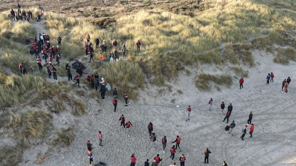 Migrants on a French beach