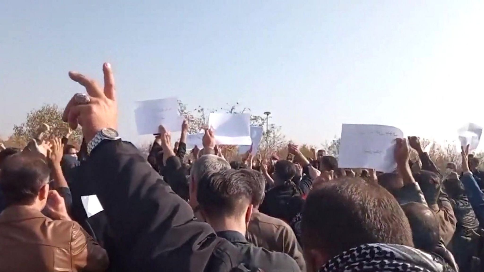 Screengrab of video posted by Kurdish human rights group Hengaw, purportedly showing a crowd protesting at the cemetery in Saqqez, Iran, where Mahsa Amini is buried (26 October 2022)