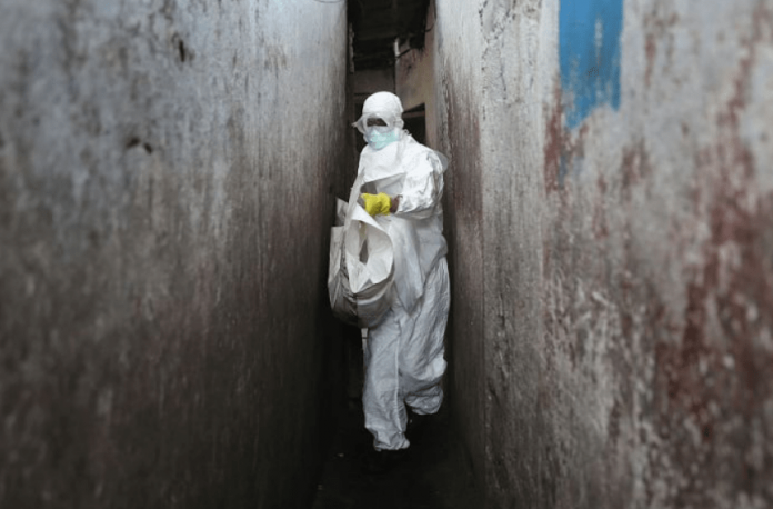 PHOTO: A Red Cross burial team wore protective clothing to visit houses where people were infected with Ebola. (Getty Images: John Moore) PHOTO: A Red Cross burial team wore protective clothing to visit houses where people were infected with Ebola. (Getty Images: John Moore)