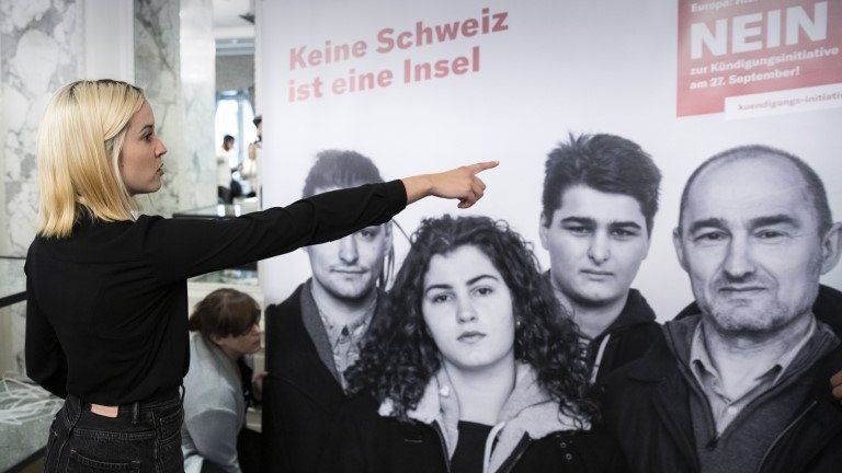 Laura Zimmermann, one of the leaders of the "no" campaign, points to a poster