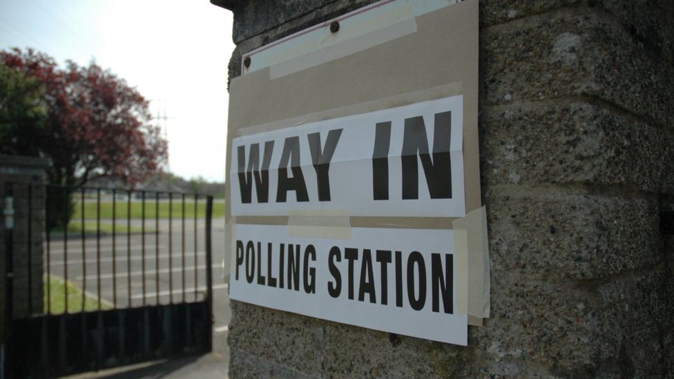 A sign outside a polling station that reads: Way in - polling station