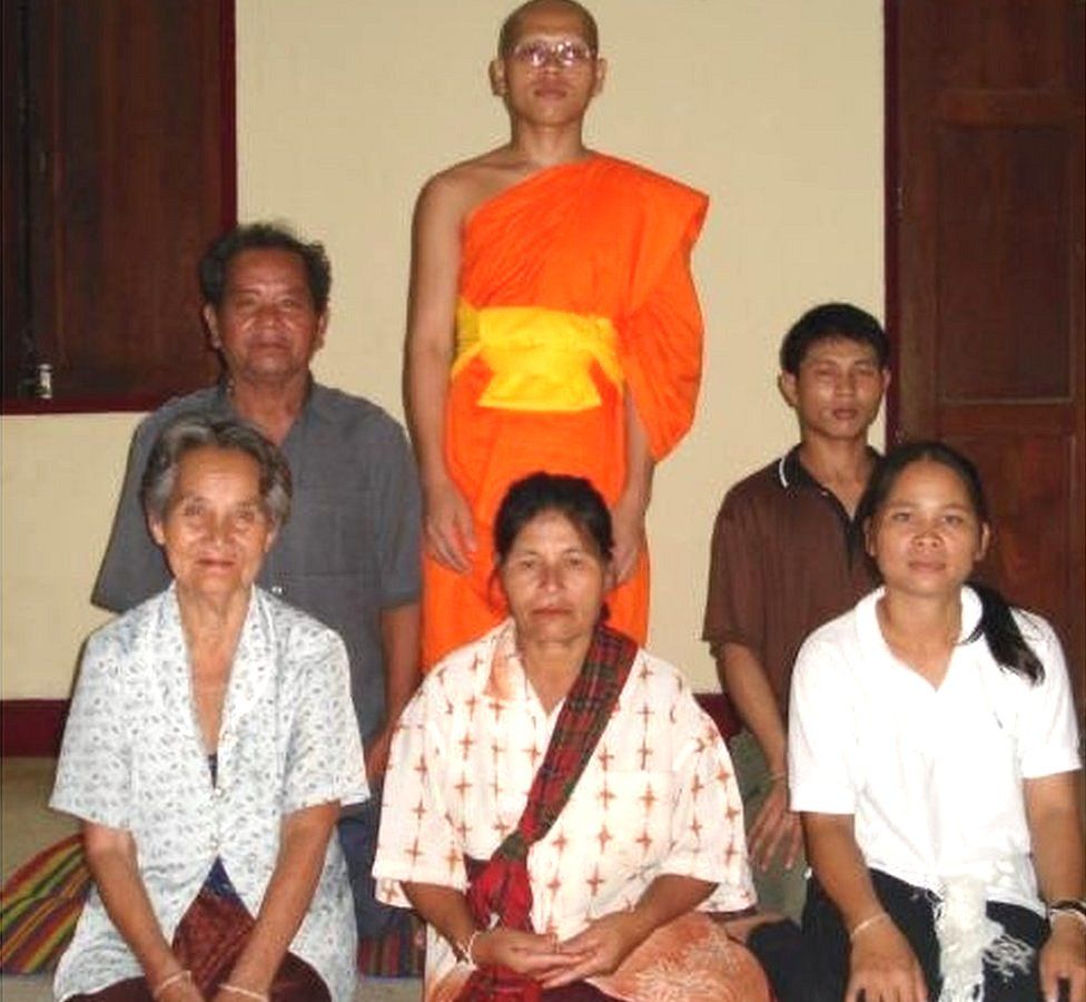 Phra Prasert with his grandmother, mother, sister-in-law, father and older brother