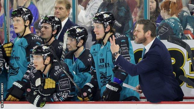 Belfast Giants coach Adam Keefe protests after one of the decisions by the match officials