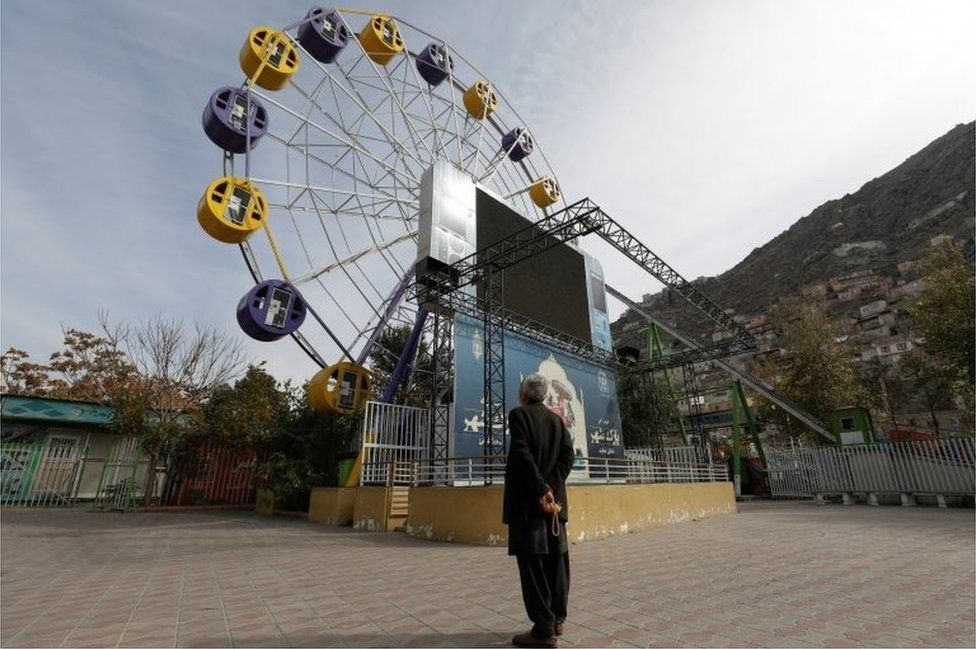 An Afghan man stands in an amusement park in Kabul, Afghanistan, November 9, 2022