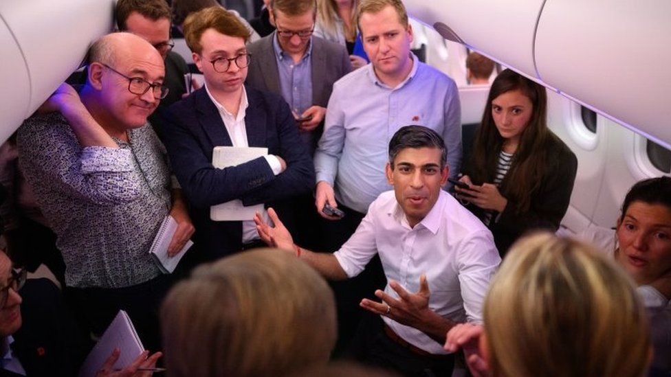 Rishi Sunak holds a press conference with political journalists on board a government plane as he heads to Bali in Indonesia for the G20 summit