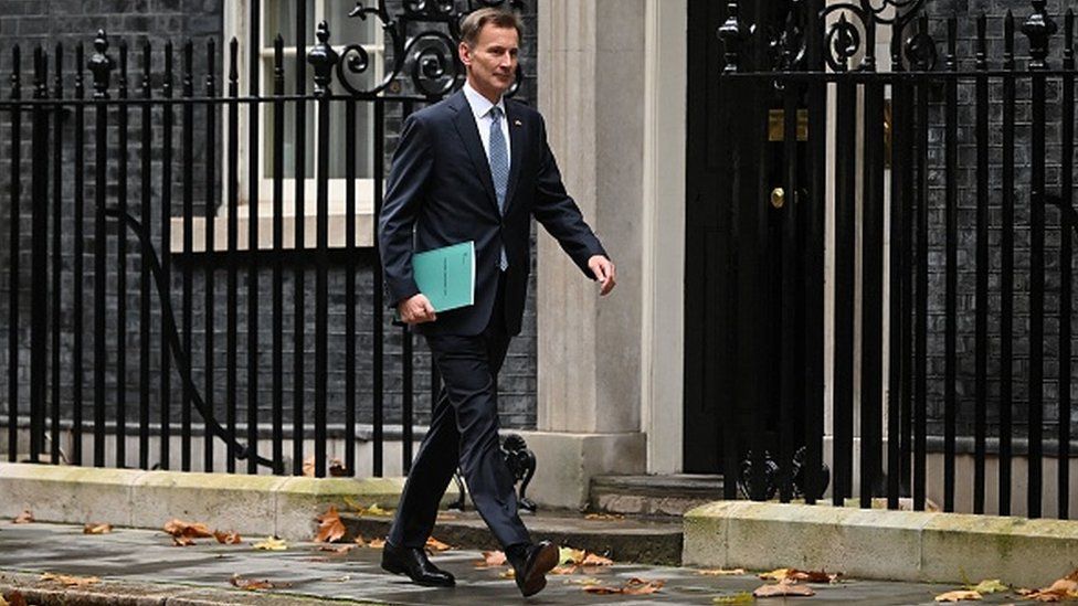 Chancellor Jeremy Hunt leaves Downing Street in central London on his way to make a full budget statement in the House of Commons