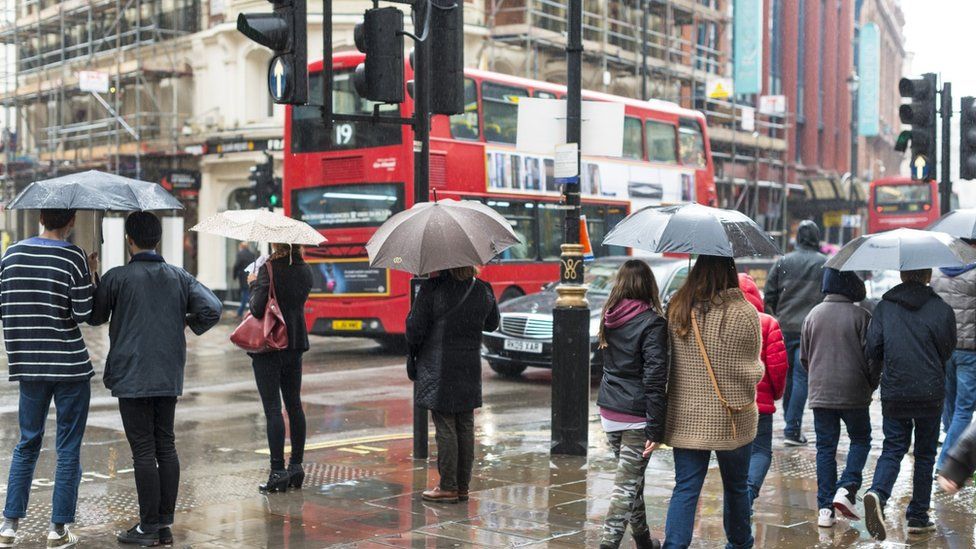 People on street in London in rain