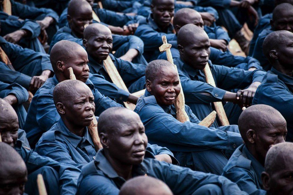 New members of South Sudan Police Service (SSPS) of the Unified Forces attend with handmade wooden rifles or sticks the graduation ceremony in Malakal on November 21, 2022