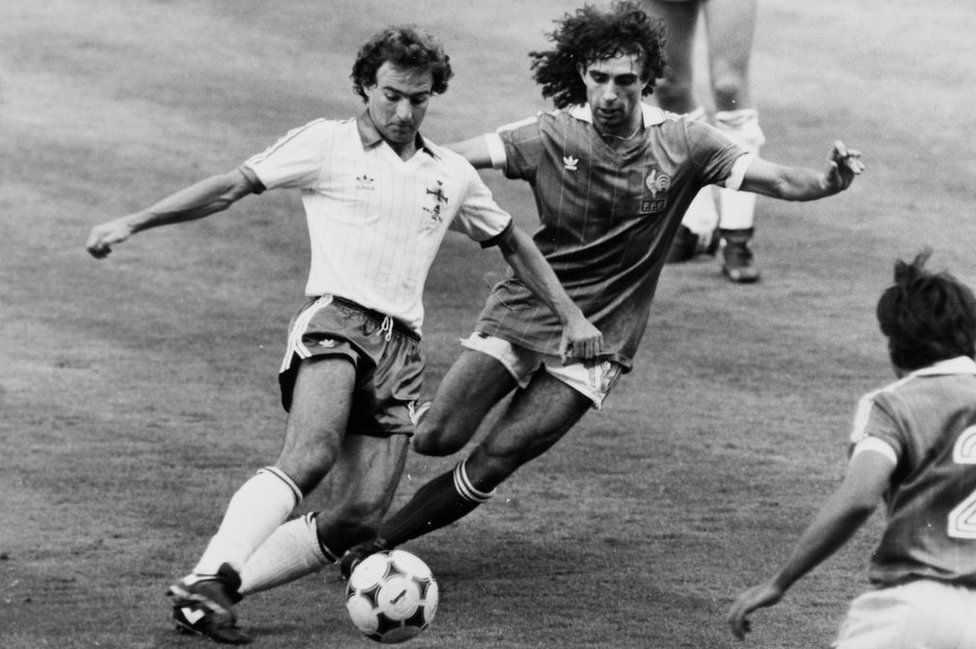 Martin O'Neill controls the ball under pressure from a French opponent